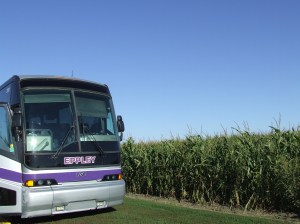 Tour bus in corn field.